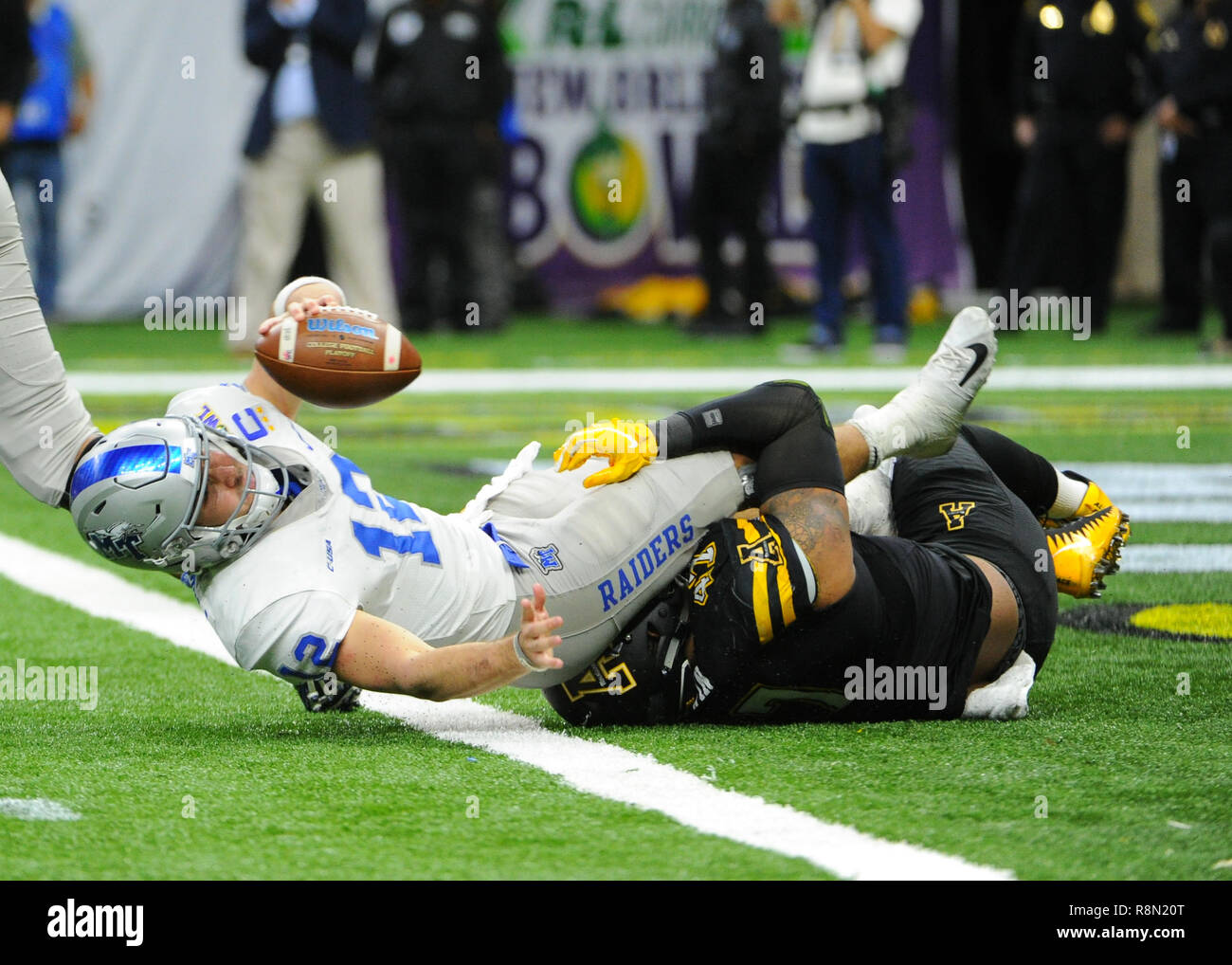 New Orleans, LA, USA. 15th Dec, 2018. Appalachian State defensive lineman, Okon Godwin (47), sacks Middle Tennessee State quarterback, Brent Stockstill (12), during the 2018 New Orleans Bowl game between the Middle Tennessee Blue Raiders and the Appalachian State Mountaineers at Mercedes-Benz Superdome in New Orleans, LA . Appalachian State defeated Middle Tennessee, 45-13. Kevin Langley/CSM/Alamy Live News Stock Photo