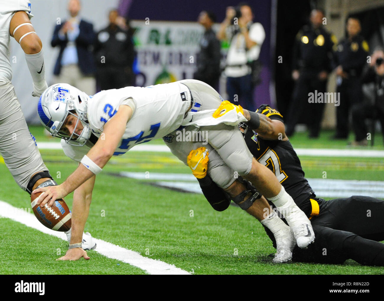 New Orleans, LA, USA. 15th Dec, 2018. Appalachian State defensive lineman, Okon Godwin (47), sacks Middle Tennessee State quarterback, Brent Stockstill (12), during the 2018 New Orleans Bowl game between the Middle Tennessee Blue Raiders and the Appalachian State Mountaineers at Mercedes-Benz Superdome in New Orleans, LA . Appalachian State defeated Middle Tennessee, 45-13. Kevin Langley/CSM/Alamy Live News Stock Photo