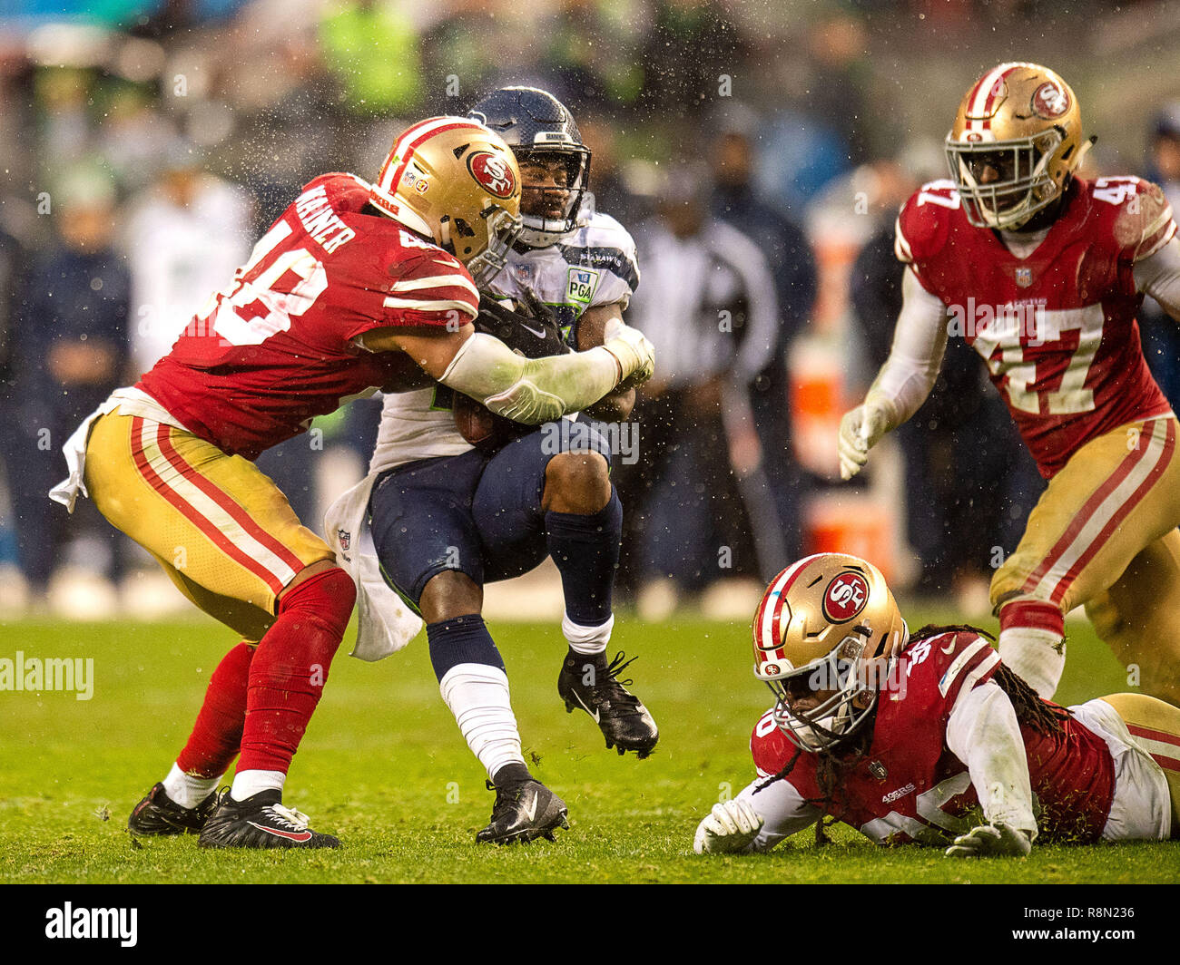 Santa Clara, CA. 16th Dec, 2018. San Francisco 49ers defensive tackle  DeForest Buckner (99) isa able to drag down Seattle Seahawks quarterback  Russell Wilson (3) during the NFL football game between the