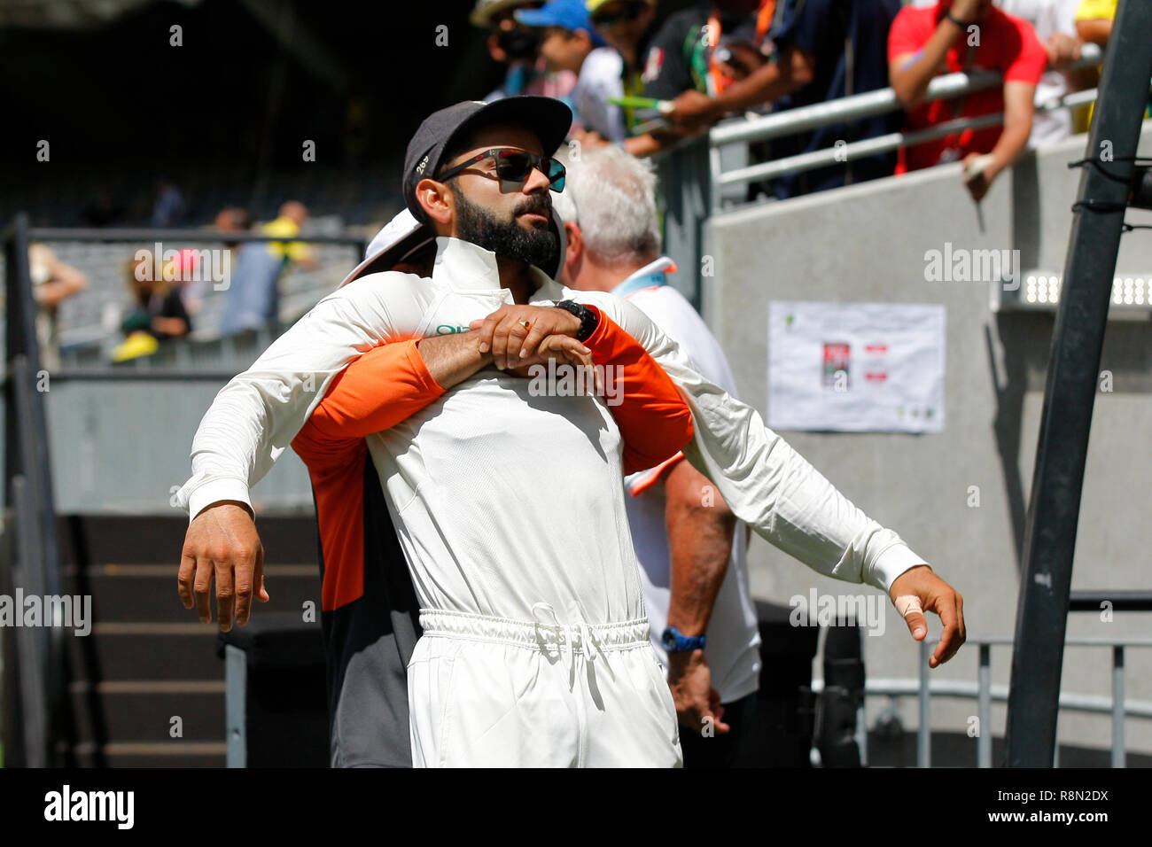Optus Stadium, Perth, Australia. 17th Dec, 2018. International Test Series Cricket, Australia versus India, second test, day 4; Virat Kohli of India has his back manipulated before the start of the 4th days play Credit: Action Plus Sports/Alamy Live News Stock Photo