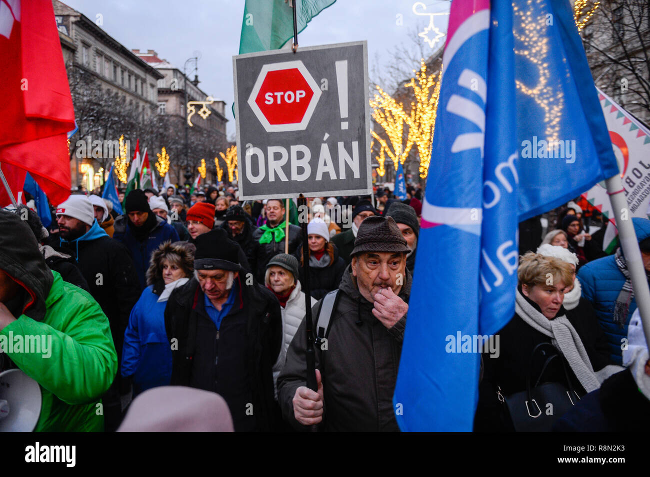 Budapest, Hungary. 16th Dec, 2018. A protester is seen holding a placard during the protest against the new labour law approved by the right wing conservative government lead by Viktor Orban. The Hungarian government has passed a set of controversial laws on judicial and labour topics, The new labour law, known as 'slave law' allows employers to ask their workers to take on up to 400 hours' overtime per year. Credit: SOPA Images Limited/Alamy Live News Stock Photo