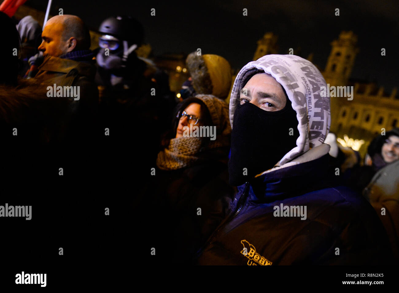 Budapest, Hungary. 16th Dec, 2018. A protester seen wearing a mask as during the protest against the new labour law approved by the right wing conservative government lead by Viktor Orban. The Hungarian government has passed a set of controversial laws on judicial and labour topics, The new labour law, known as 'slave law' allows employers to ask their workers to take on up to 400 hours' overtime per year. Credit: SOPA Images Limited/Alamy Live News Stock Photo