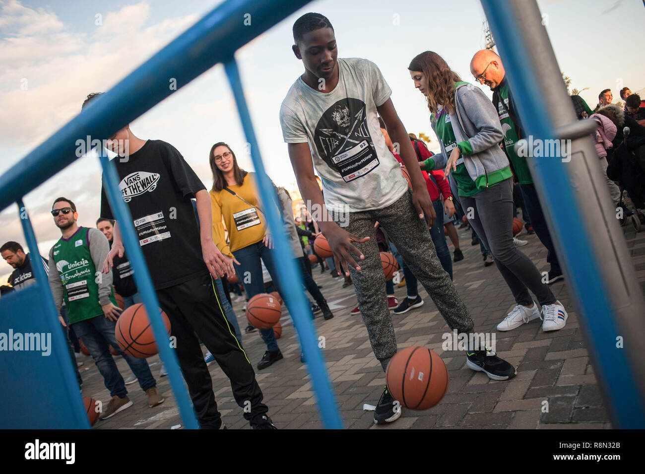 Malaga, Spain. 16th Dec, 2018. Participants are seen bouncing basketballs before the first attempt to beat the Guinness World Record of people bouncing basketballs at the same time during five minutes, outside the Sport Palace Jose Maria Martin Carpena in Malaga. The previous record was got in Palestine in 2010 with 7.756 people. Credit: SOPA Images Limited/Alamy Live News Stock Photo