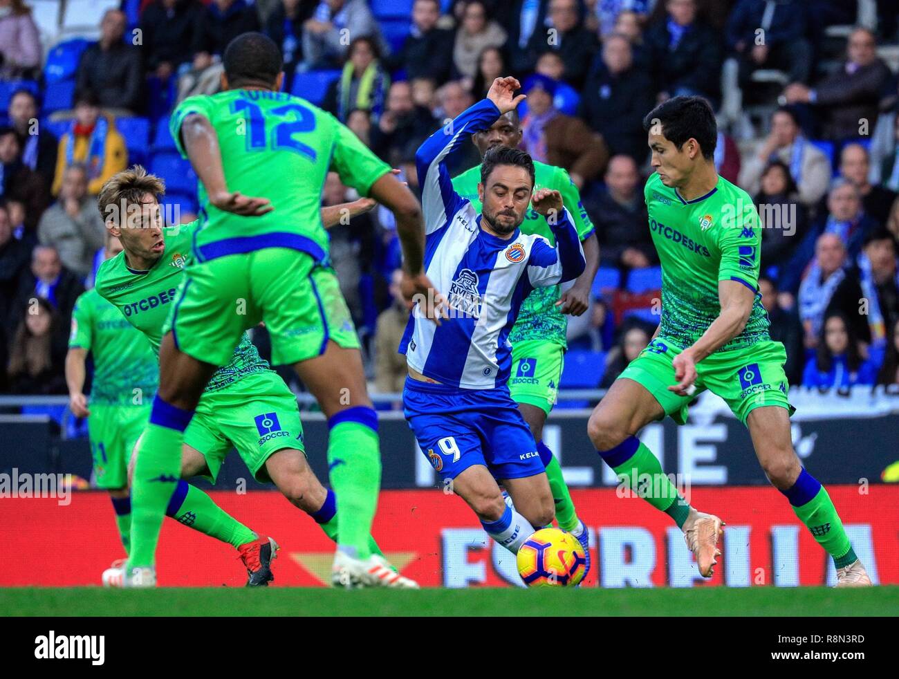 Barcelona, Spain. 16th Dec, 2018. RCD Espanyol's Sergio Garcia (C) vies for the ball during a Spanish league match between RCD Espanyol and Real Betis in Barcelona, Spain, on Dec. 16, 2018. Real Betis won 3-1. Credit: Joan Gosa/Xinhua/Alamy Live News Stock Photo
