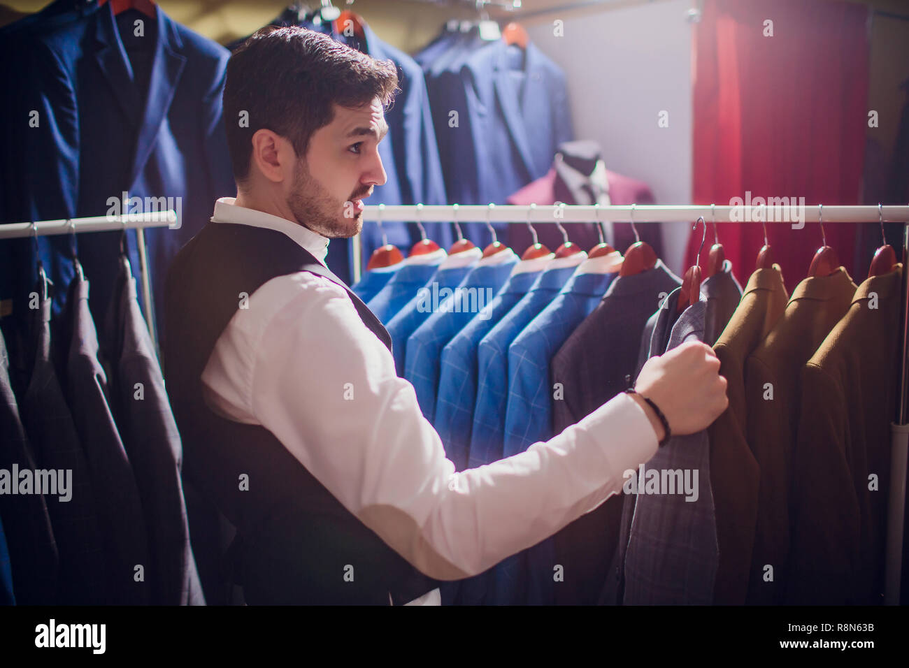 Tailor, tailoring. Men's suit, tailor in his Elegant man's