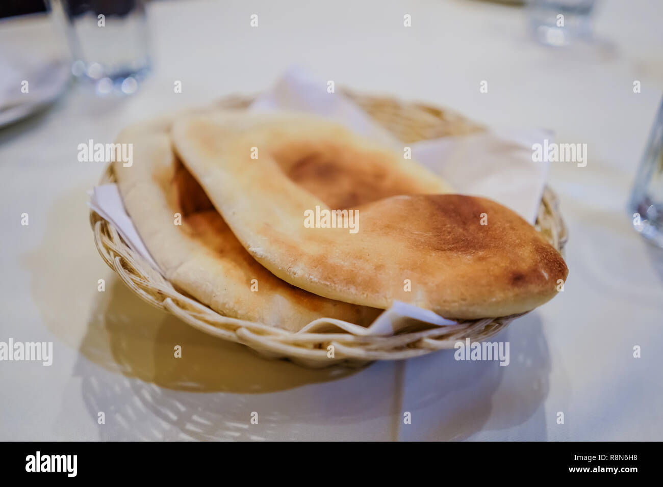 pita bread on a basket inside a middle eastern restaurant Stock Photo