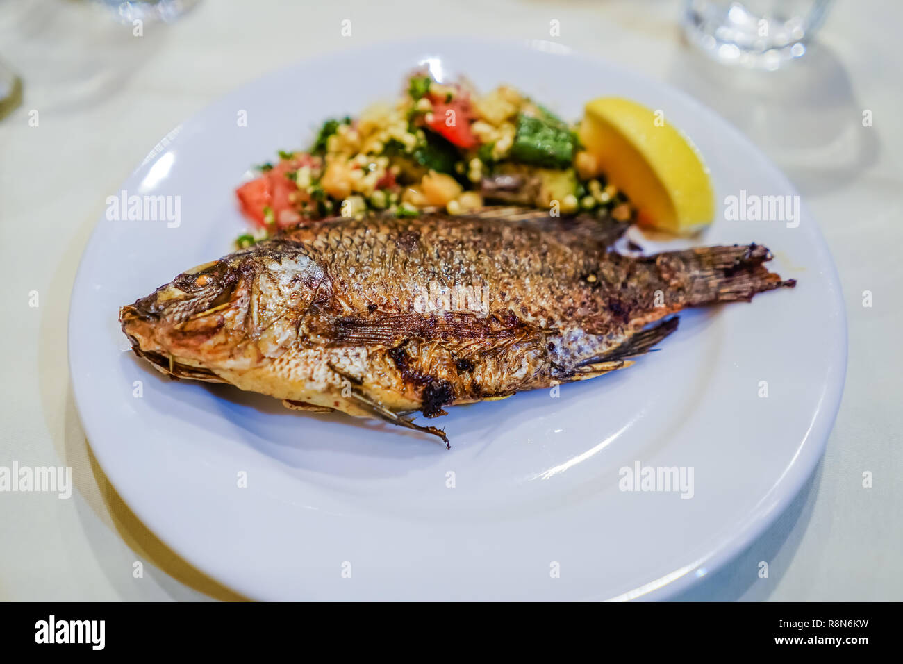 grilled fish with vegetables Stock Photo - Alamy