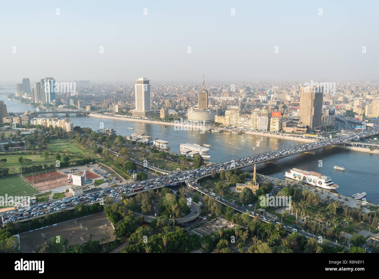 Sunset scene from the top of cairo tower in Egypt shows Egyptian TV and radio buliding ,  the nile , the city , buildings and bridge Stock Photo