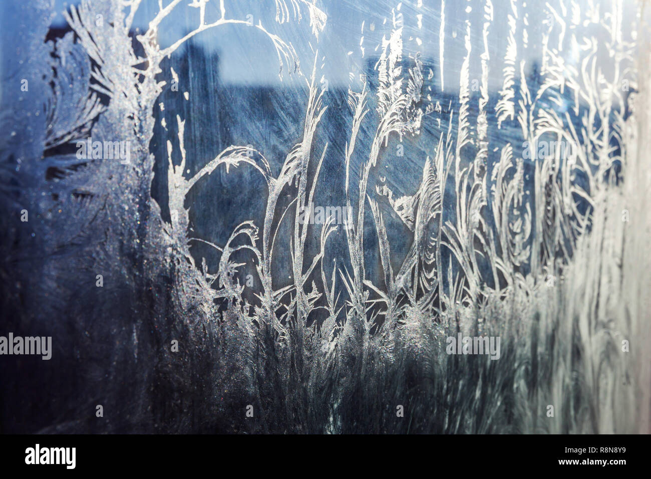 Frozen winter window with shiny ice frost pattern texture. Christmas ...