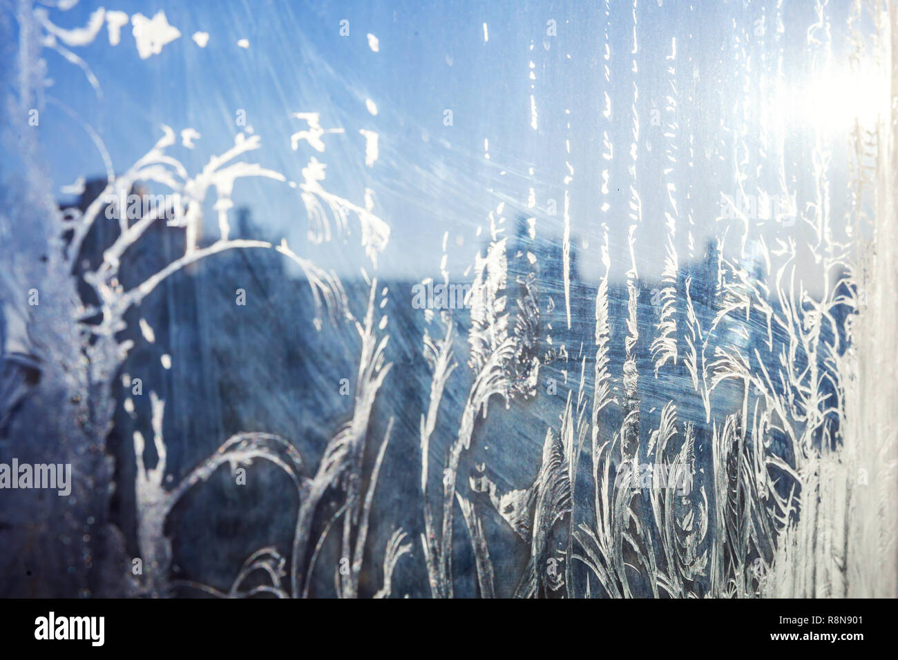 Frozen winter window with shiny ice frost pattern texture. Christmas ...