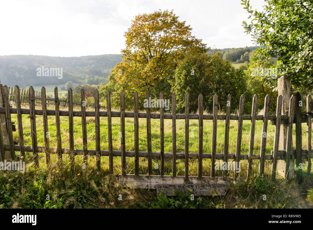 Old broken wooden fence. Rural mountain landscape. Silesian Beskids, Poland. Stock Photo