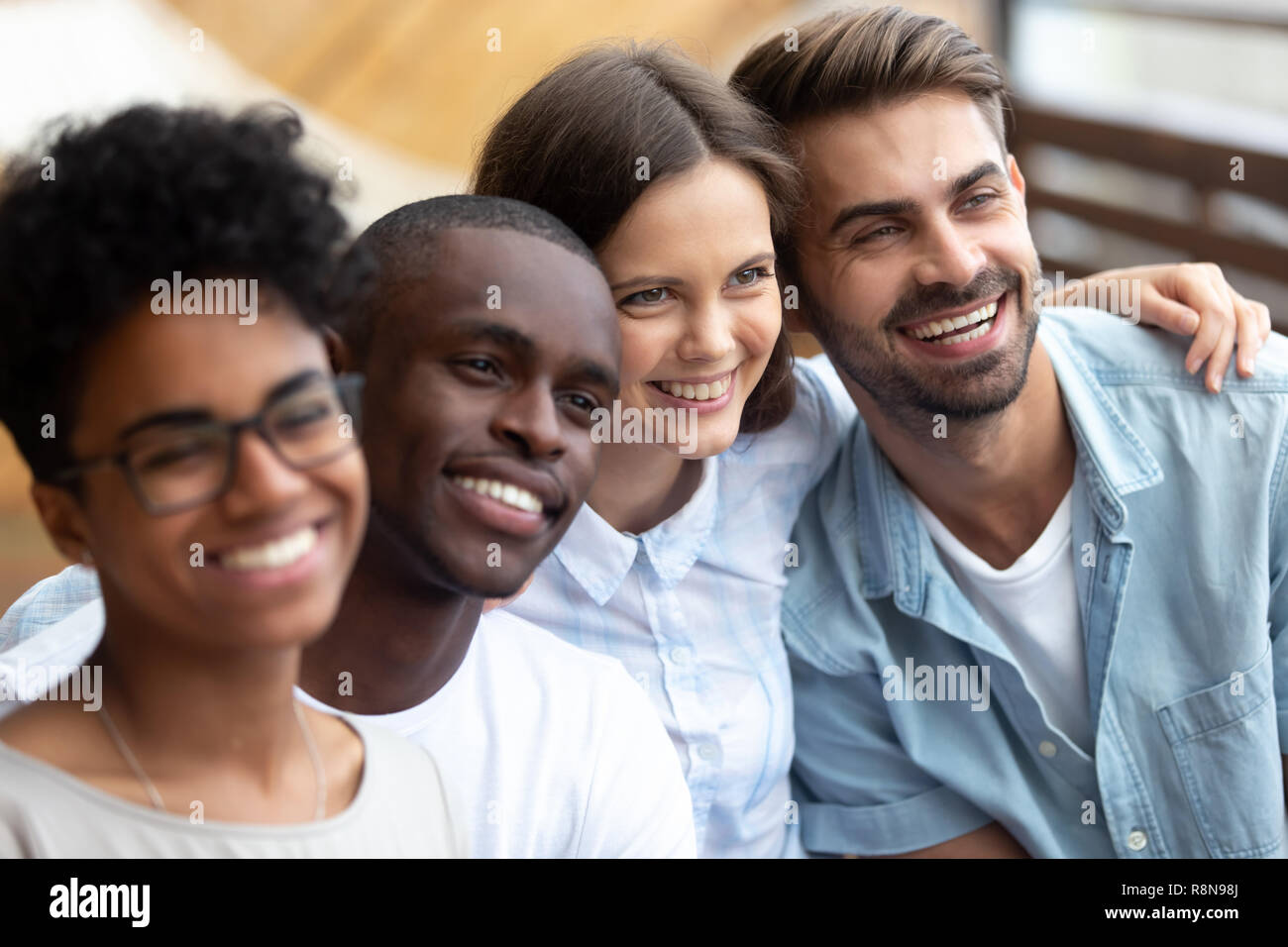 Happy multiethnic friends posing for photo together close up Stock Photo