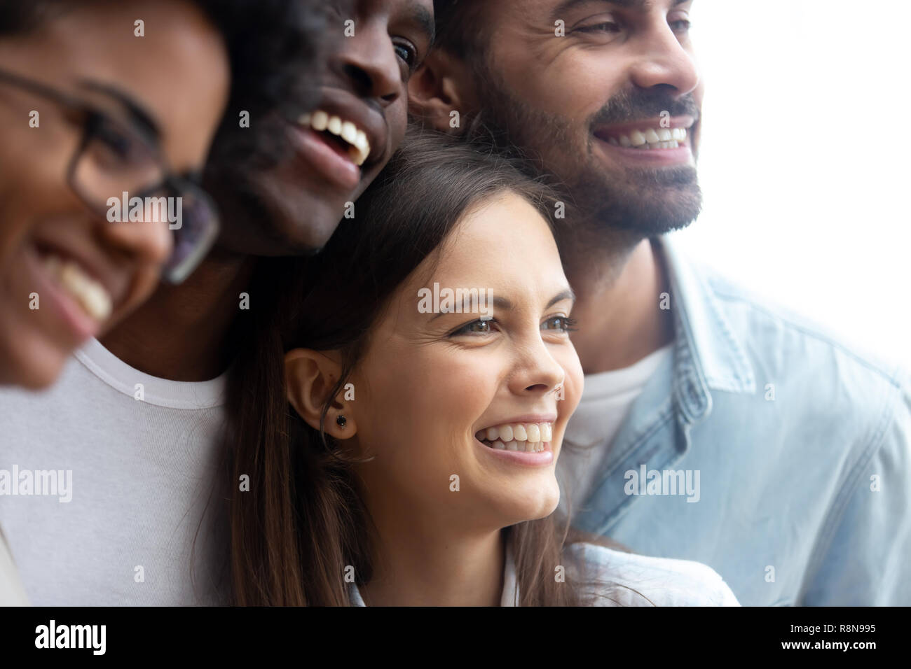 Happy smiling multiethnic friends having fun together close up Stock Photo