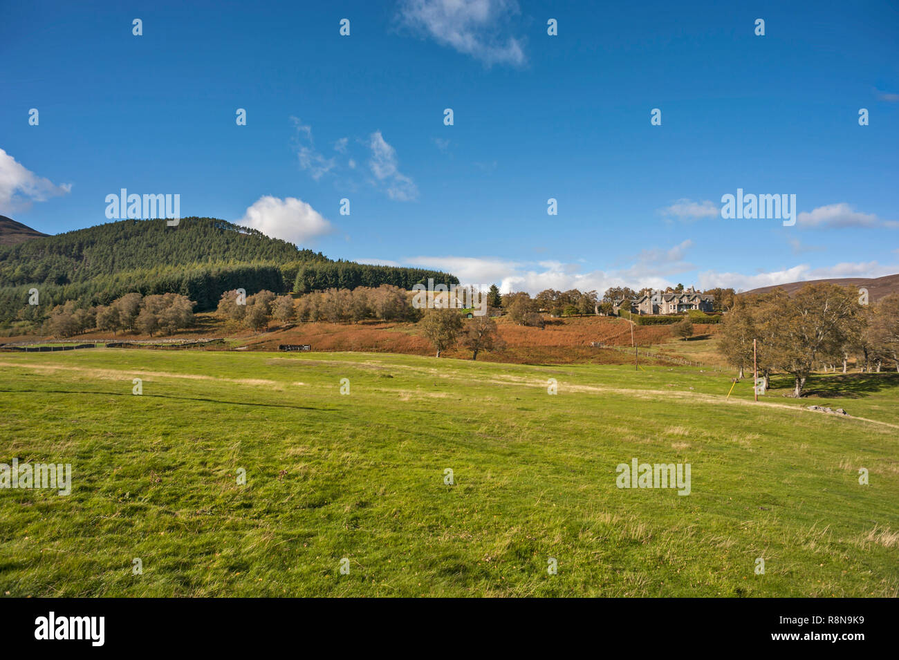 Distant view over fields of Invermark Lodge, Dalhousie Estate, Glen Esk ...