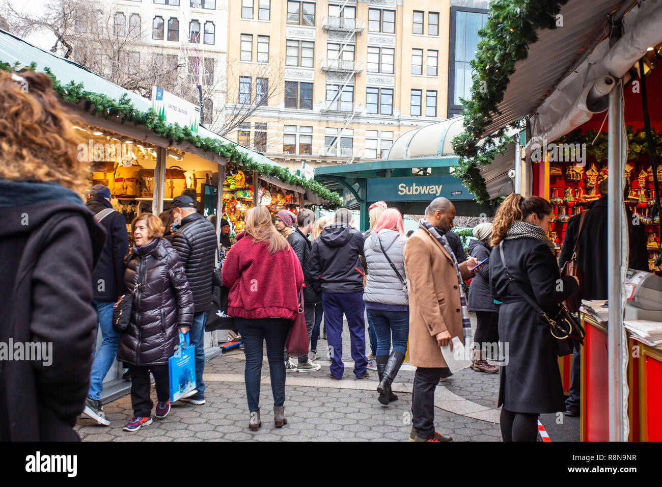 NEW YORK CITY - DECEMBER 14, 2018: View of people Christmas shopping at the Union Square Greenmarket and Holiday Market boutiques in Manhattan Stock Photo