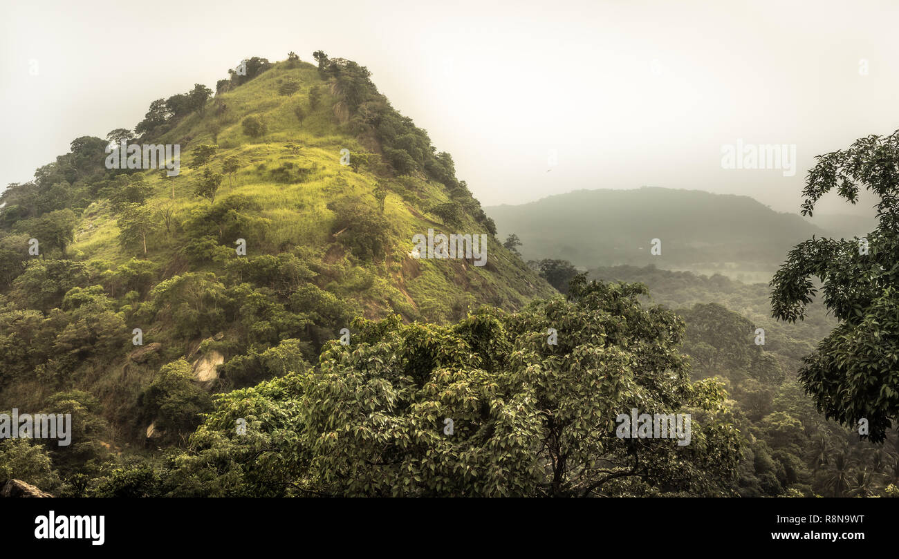 Mountain tropical forest scenery landscape with dramatic sky in Asian Sri Lanka Dambulla surroundings Stock Photo