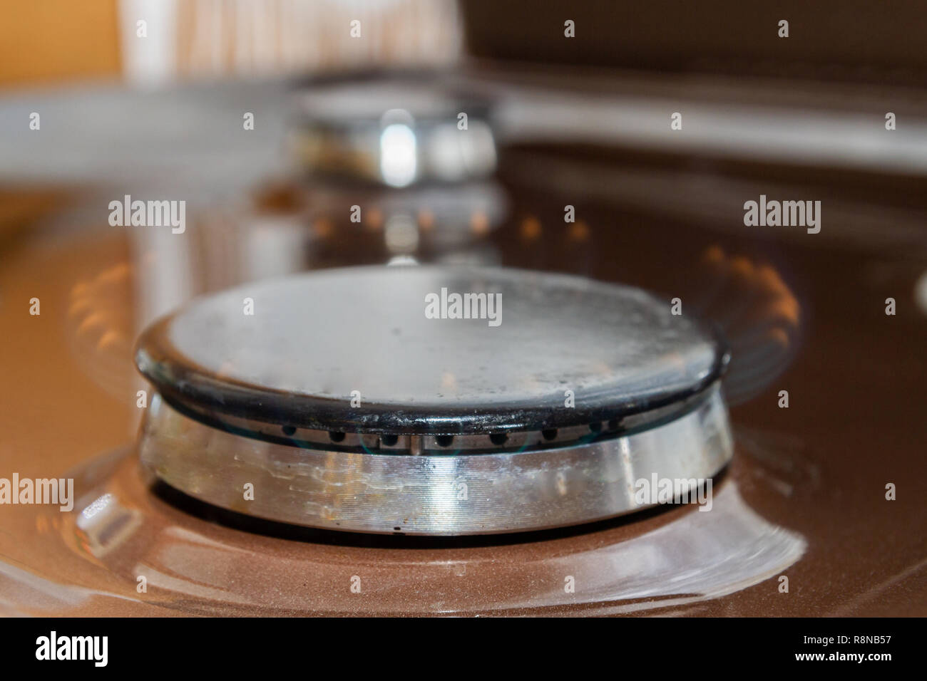 Gas stove with burning orange and blue fire on it Stock Photo Alamy