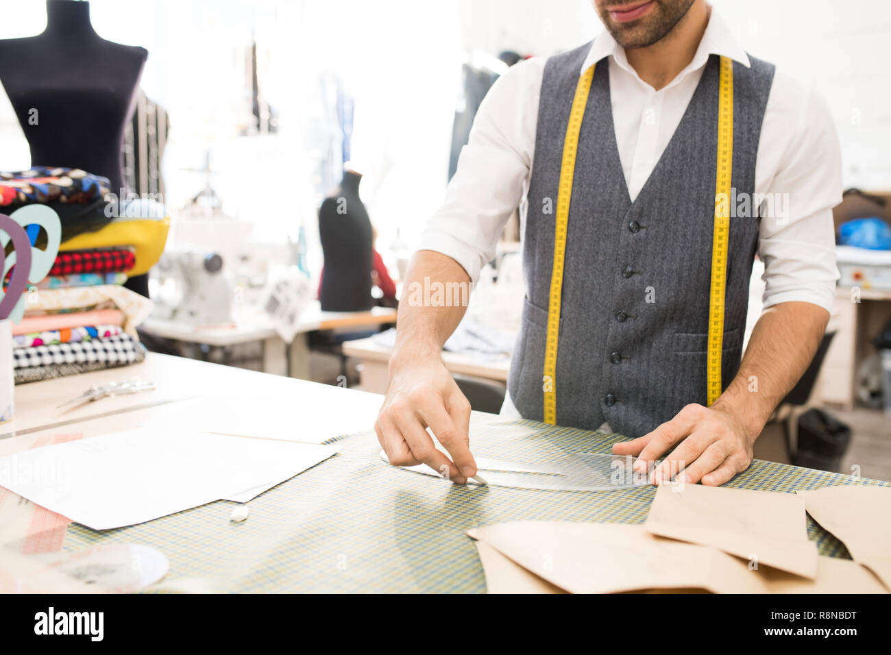 Male Tailor Making Patterns Stock Photo - Alamy