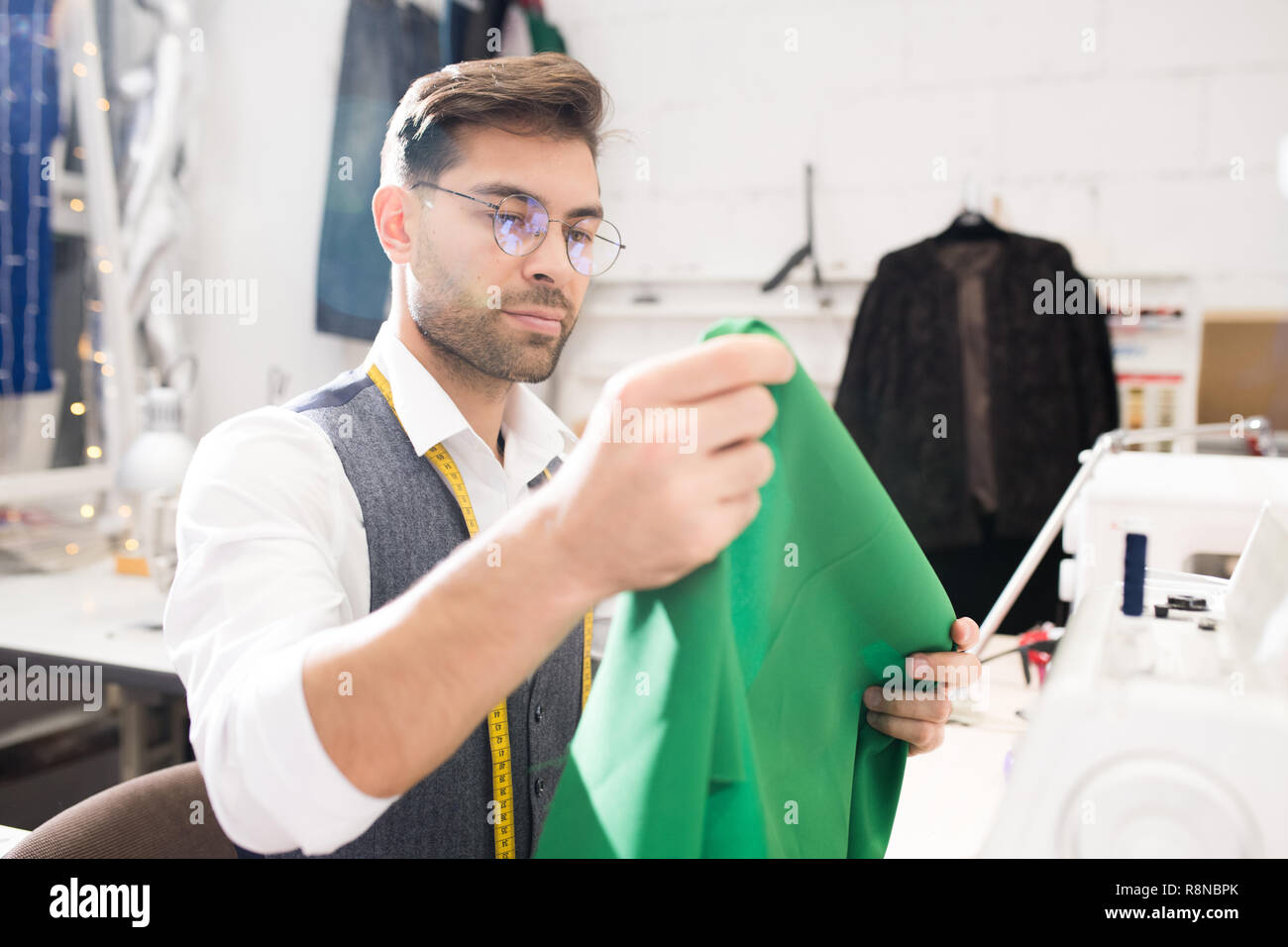 Male Tailor Using Sewing Machine Stock Photo Alamy