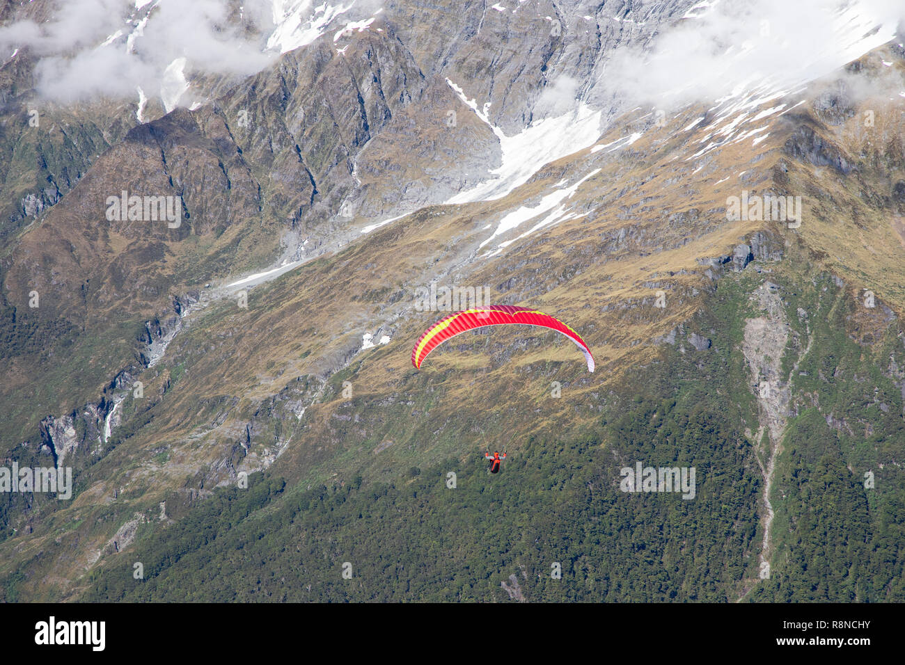 Paraglider flying in National Park, New Zealand Stock Photo
