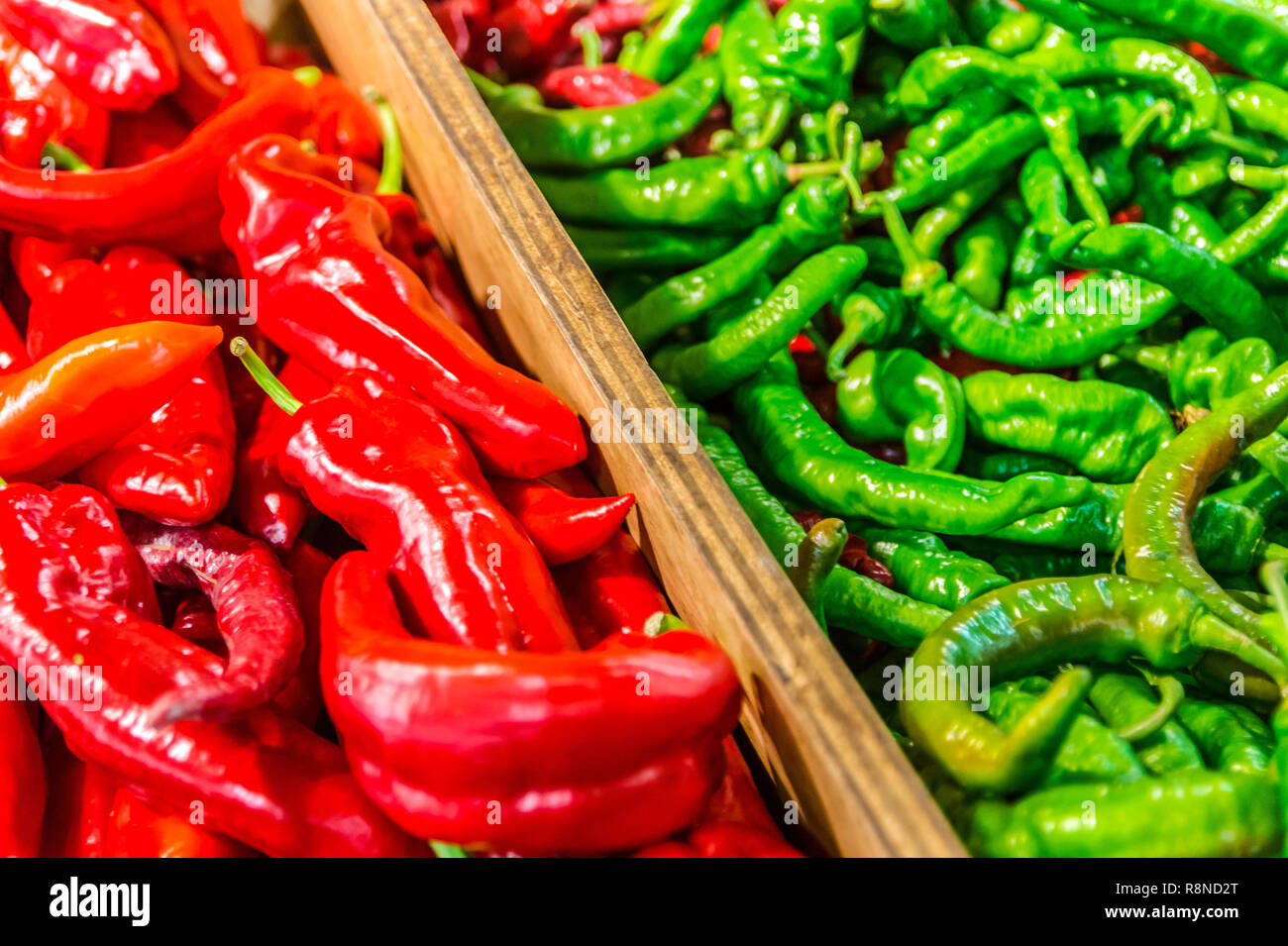 A wide variety of peppers, including Italian sweet peppers and long hot peppers, are displayed at Buford Highway Farmers Market in Doraville, Georgia. Stock Photo