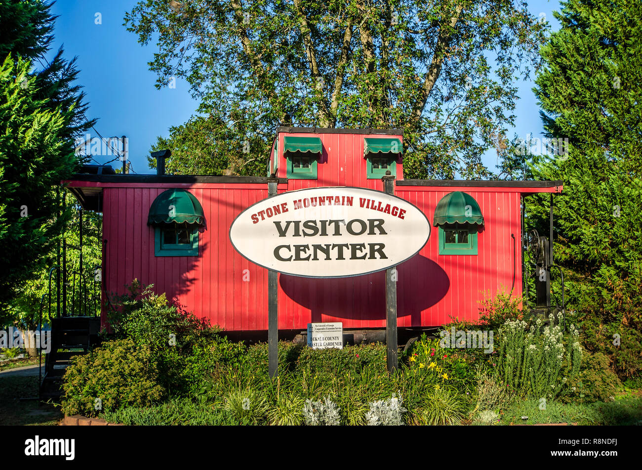 A 1914 Seaboard Railroad cupola caboose (No. 5506) serves as the visitor center for Stone Mountain Village in Stone Mountain, Georgia. Stock Photo