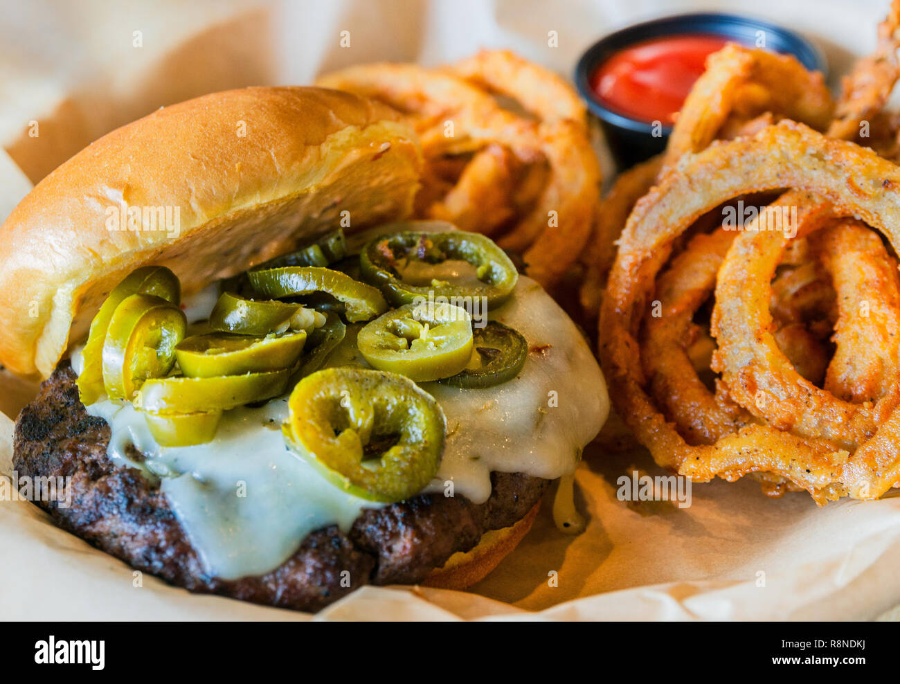 The 'Cannonball Express' at The Local No. 7 in Tucker, Georgia features a char-broiled hamburger patty, jalapeños, pepperjack cheese, and 7 sauce. Stock Photo