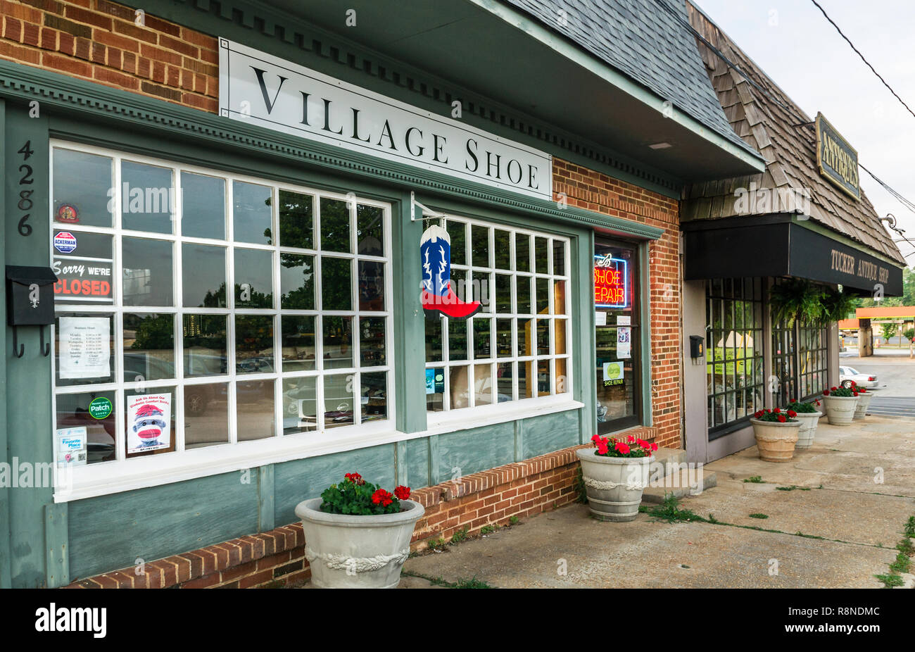 Village Shoe and Tucker Antique Shop are two of the many locally-owned businesses found in downtown Tucker, Georgia. Stock Photo