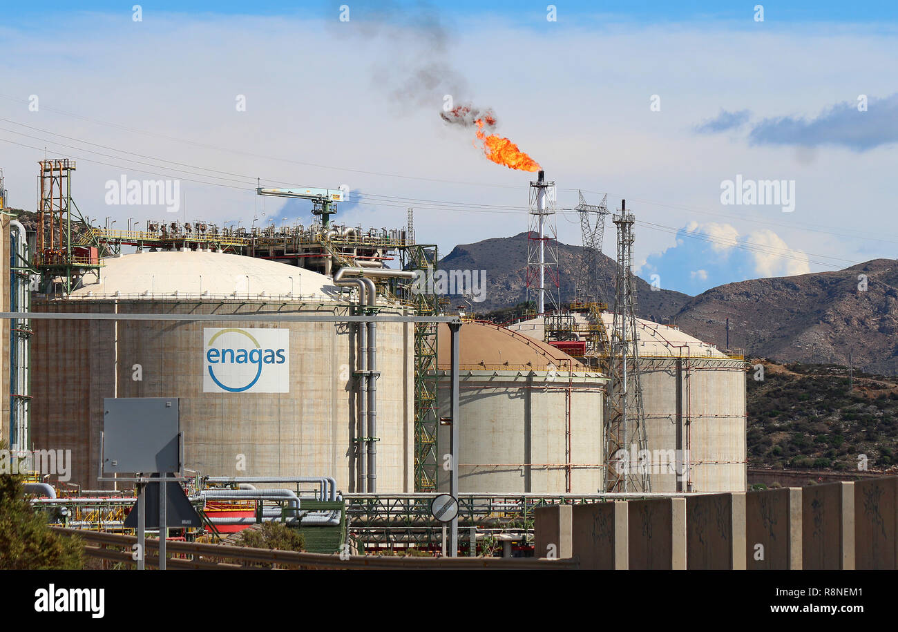 The oil refinery of Cartagena, Spain. Here are three of the storage tanks and a flare stack burning off gas. 10/14/2014. Stock Photo