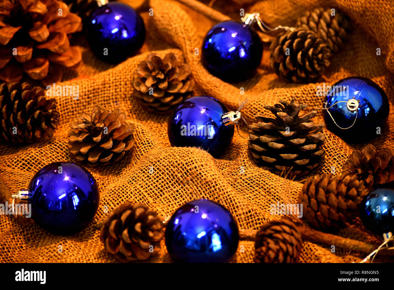 Blue Christmas balls and pine cones. Stock Photo