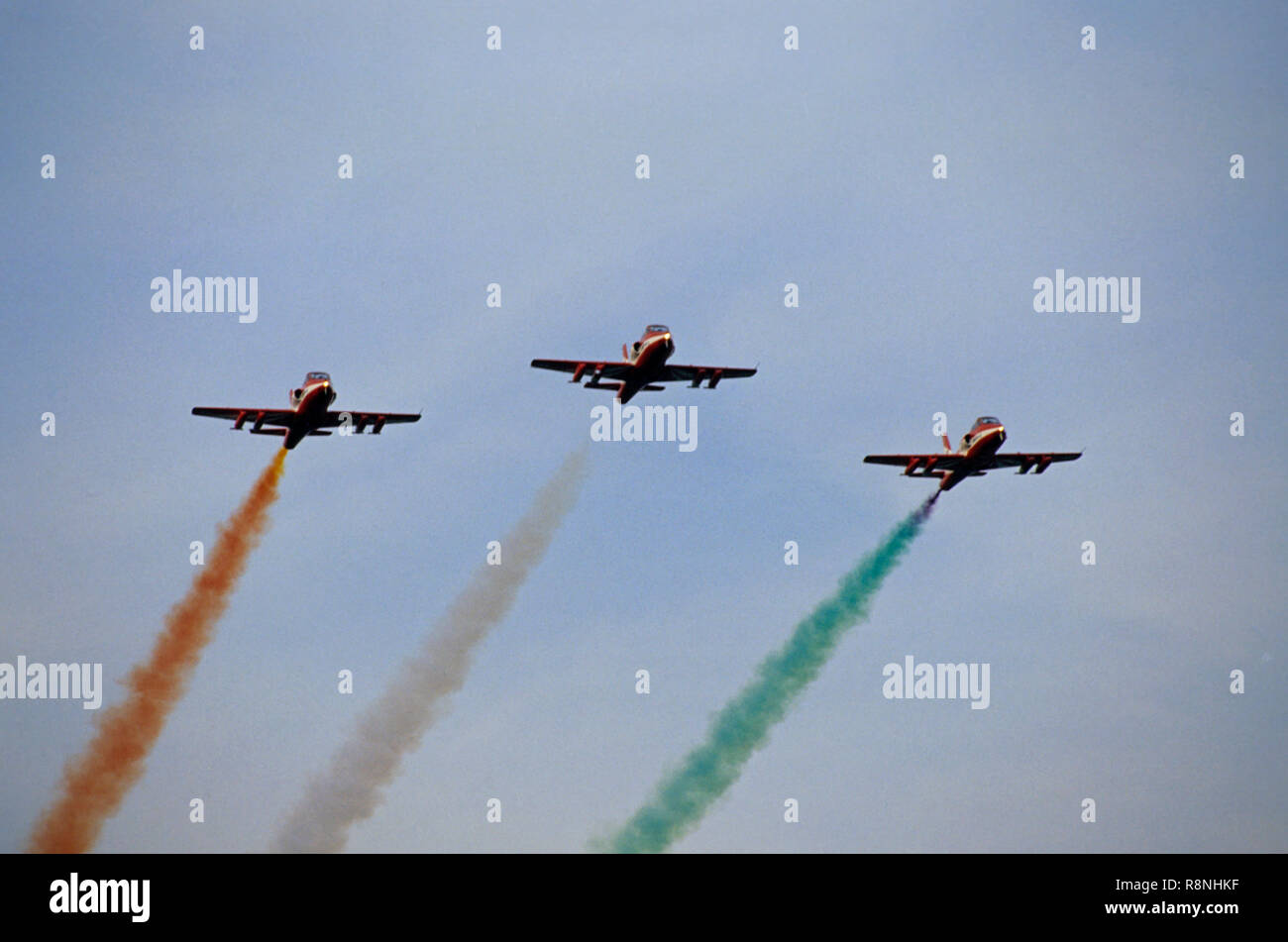 Indian Air Force aircraft flying three planes formation air show smoke flag of India Indian flag Stock Photo