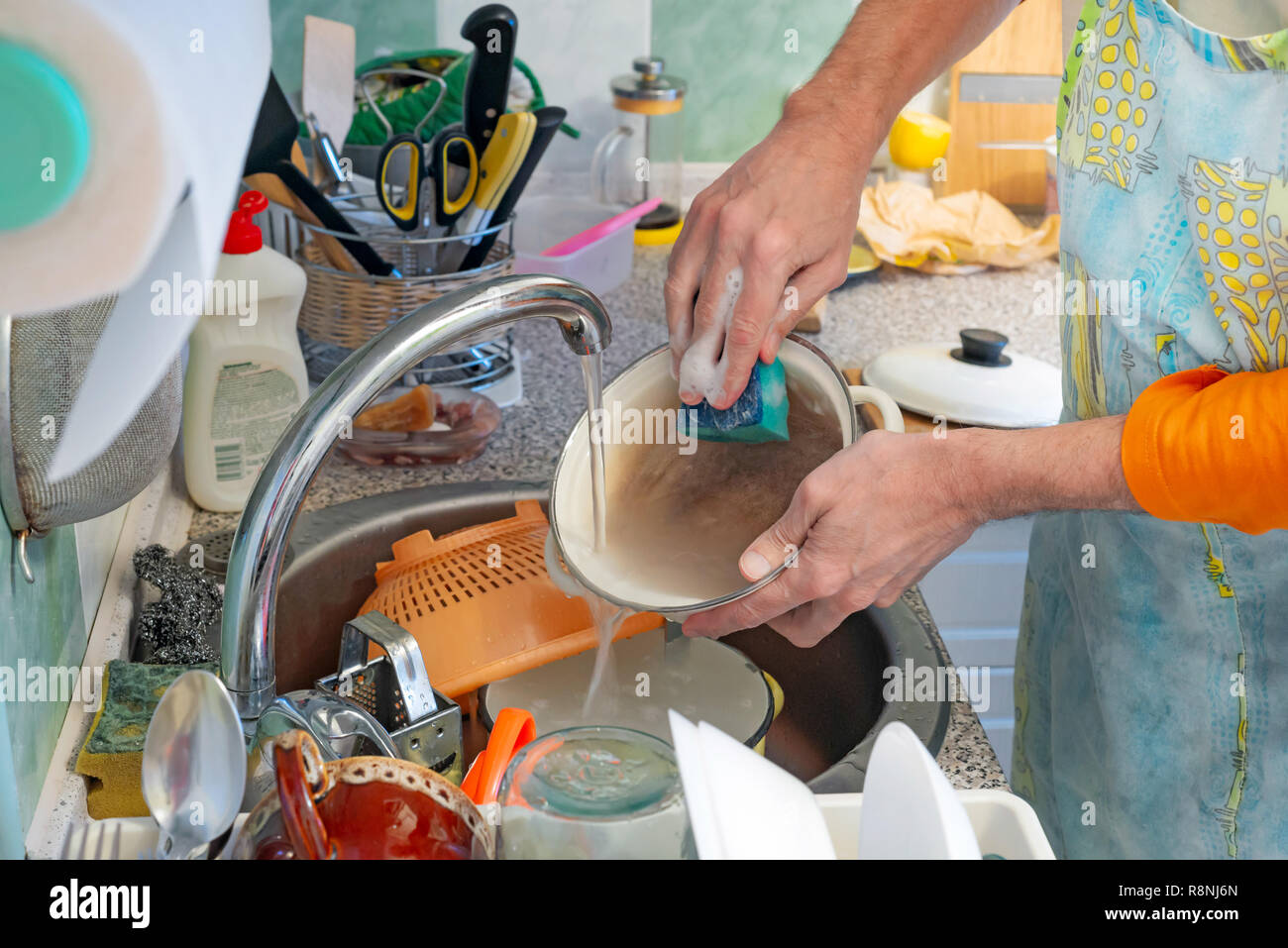 Portrait man washing dishes in hi-res stock photography and images - Alamy