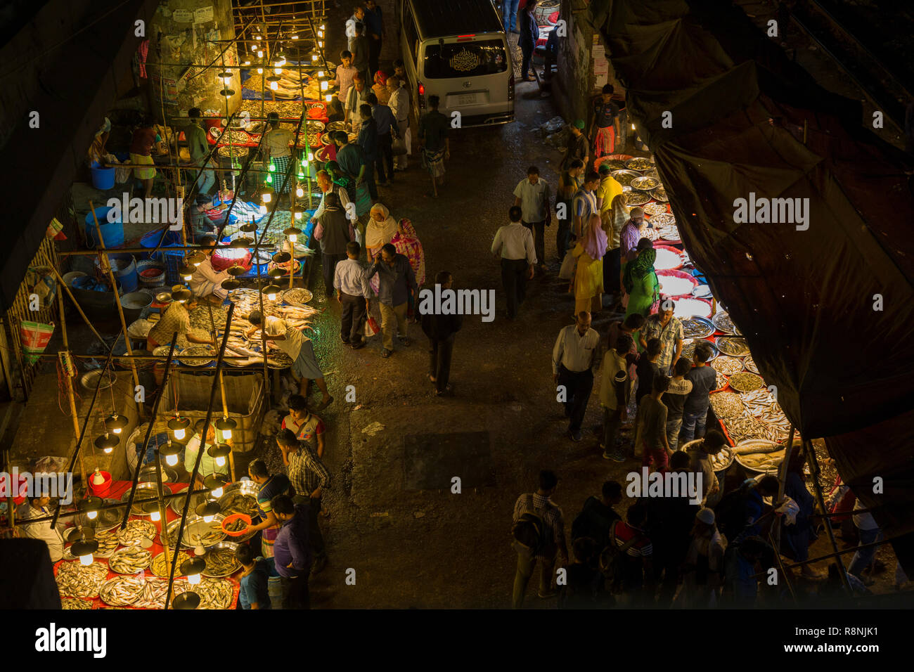 DHAKA, BANGLADESH DECEMBER 15 Bangladeshi people browsw fish in a