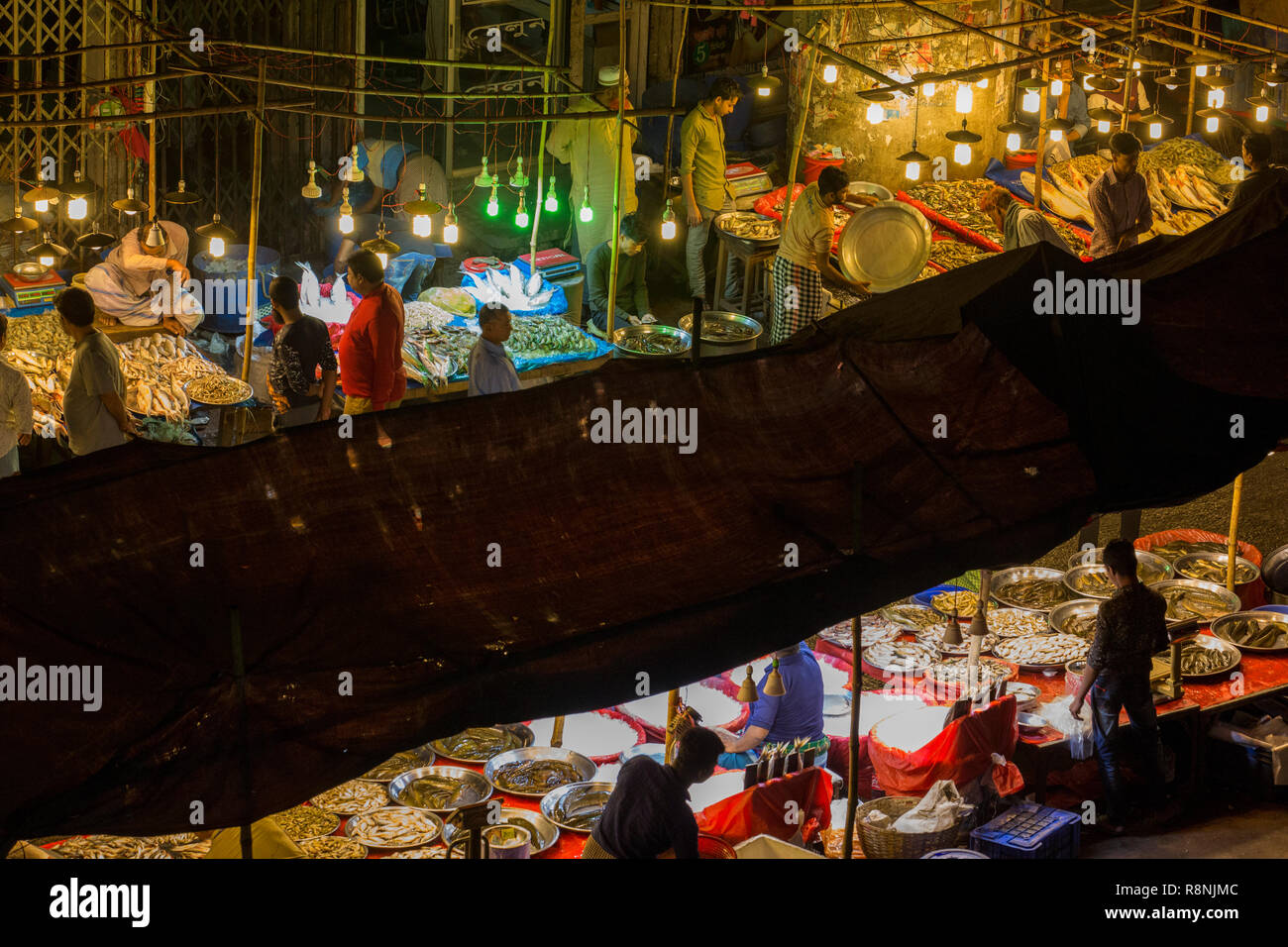 DHAKA, BANGLADESH DECEMBER 15 Bangladeshi people browsw fish in a