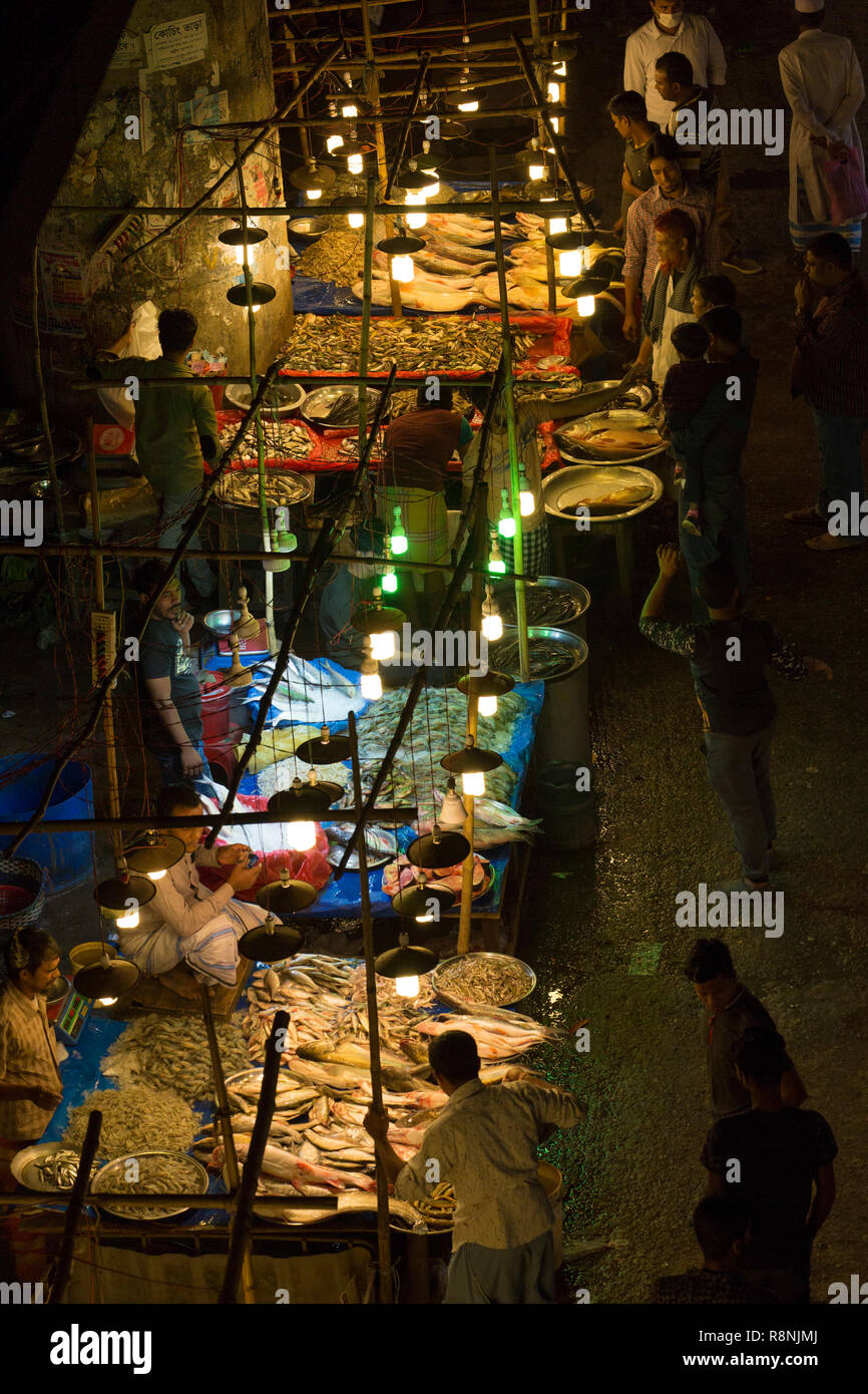 DHAKA, BANGLADESH DECEMBER 15 Bangladeshi people browsw fish in a
