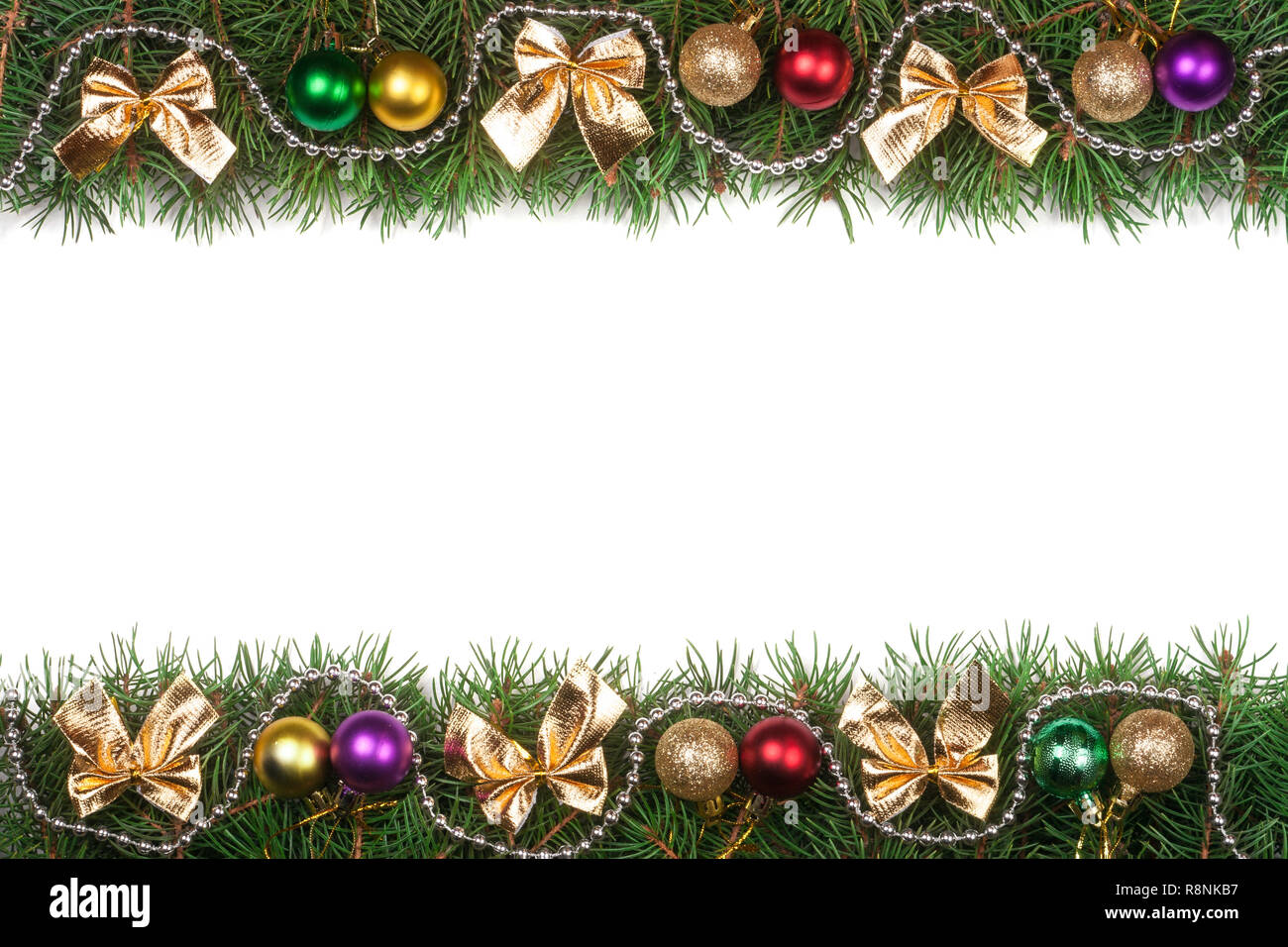 Christmas frame made of fir branches decorated with balls beads and ...