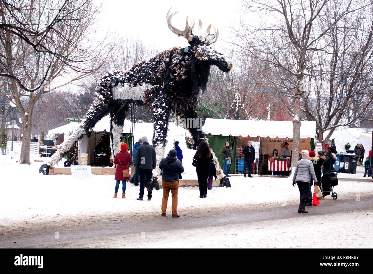 Moose art statue made from 90 recycled materials standing over the