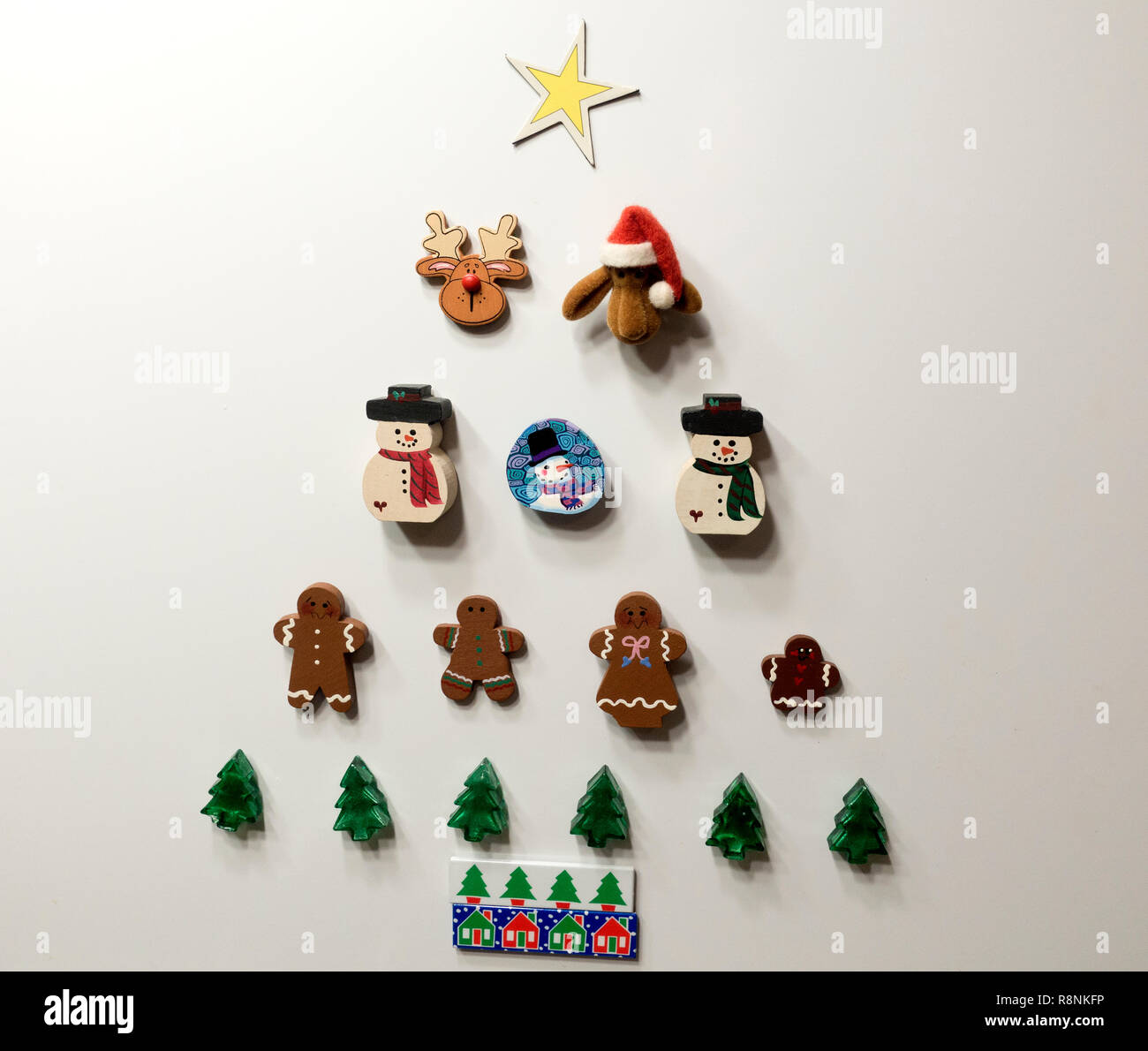 Cute miniature Christmas decorations hung on the wall in the form of a  Christmas tree. St Paul Minnesota MN USA Stock Photo - Alamy