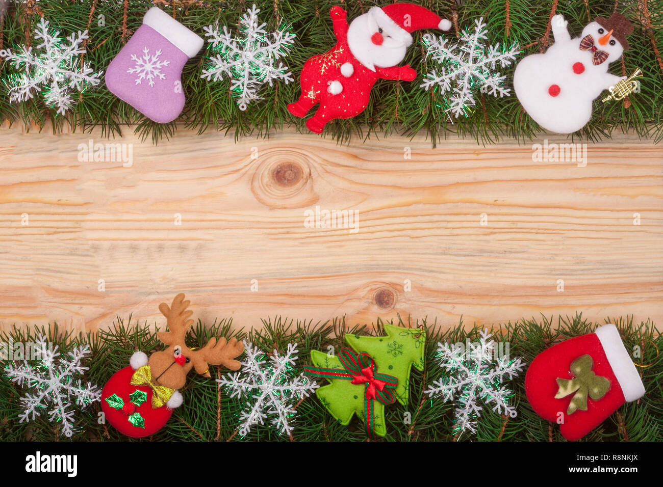 Christmas frame made of fir branches decorated with snowflakes Snowman ...