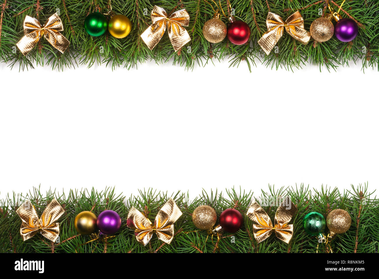 Christmas frame made of fir branches decorated with balls and golden ...