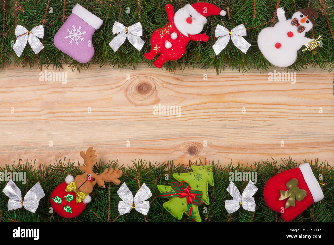 Christmas frame made of fir branches decorated with white bows Snowman ...