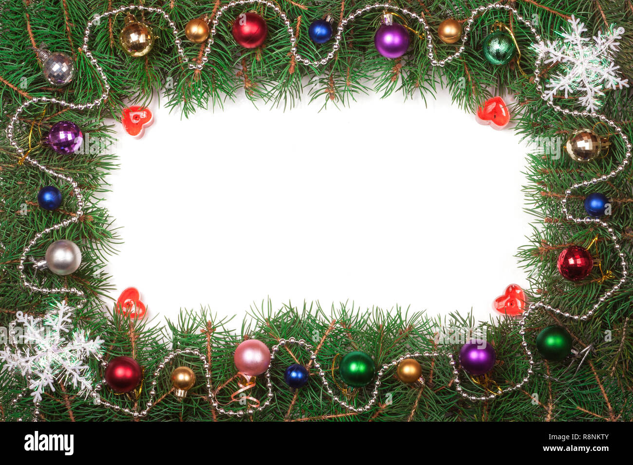 Christmas frame made of fir branches decorated with balls isolated on ...