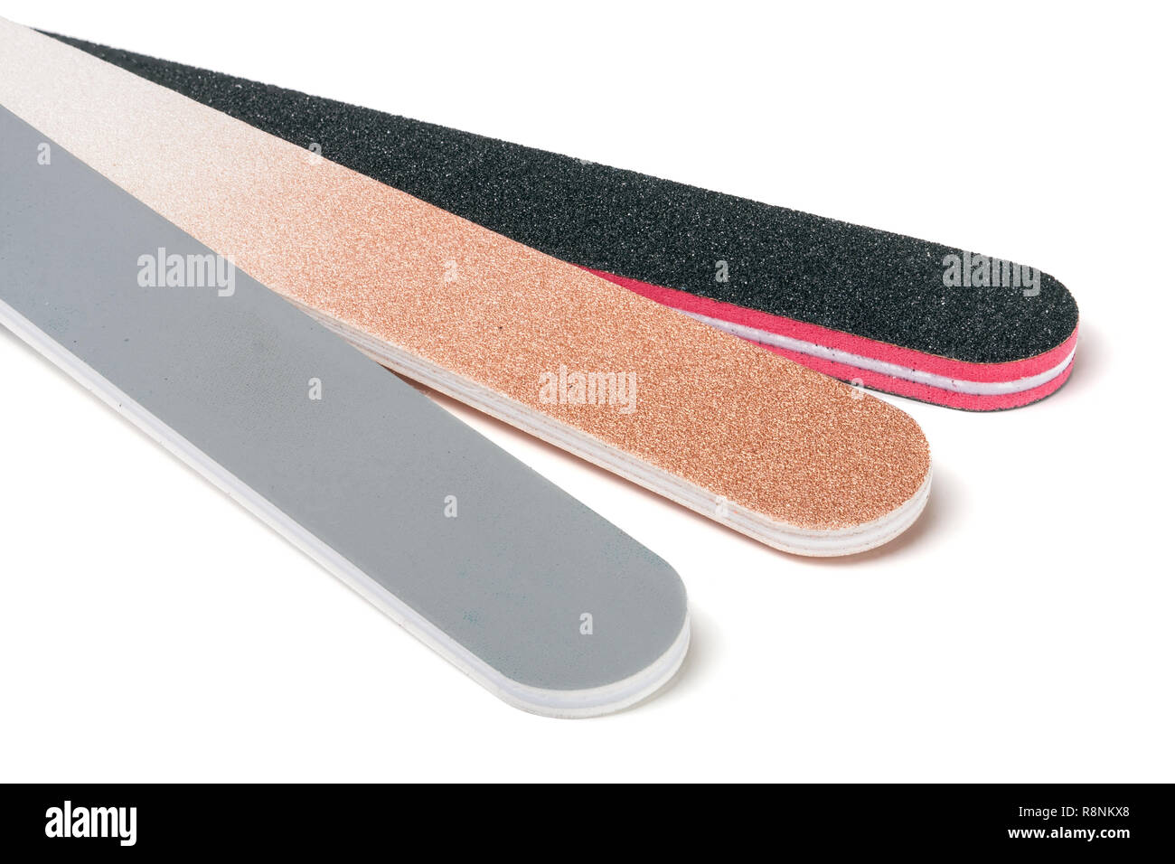Three nail file with a different abrasive isolated on white background