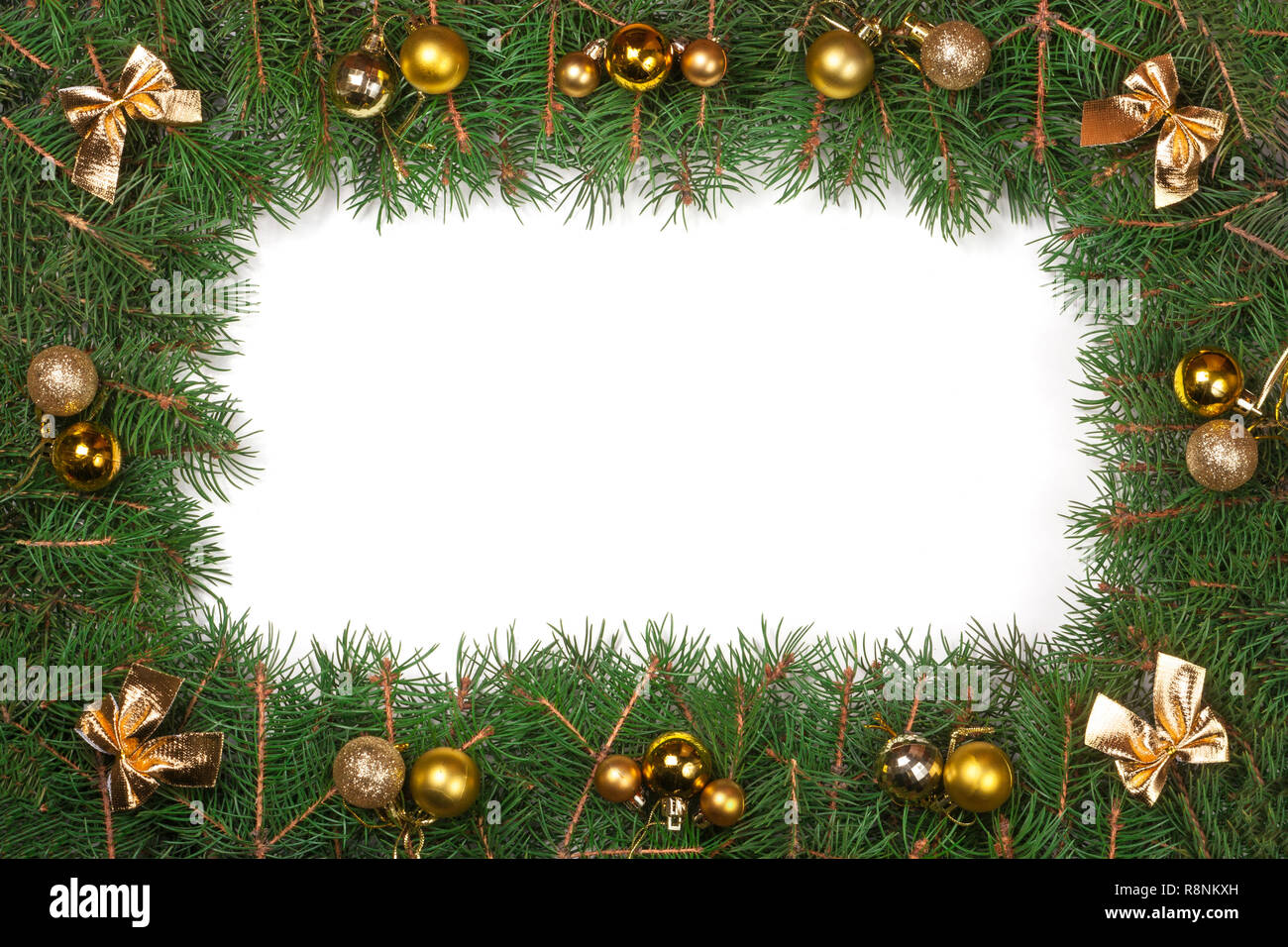 Christmas frame made of fir branches decorated with bows and snowflakes ...