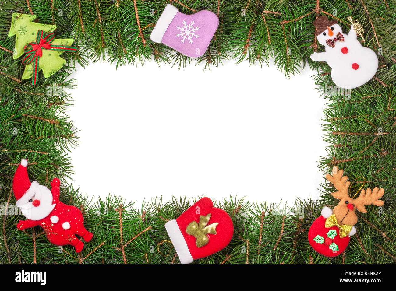 Christmas frame made of fir branches decorated with Snowman and Santa ...