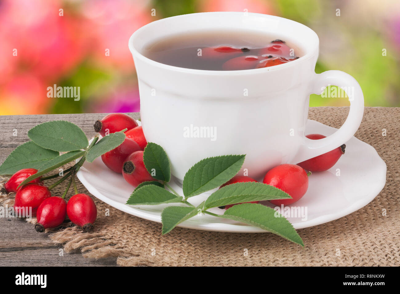 Tea from the hips on the wooden table with a blurred background Stock Photo
