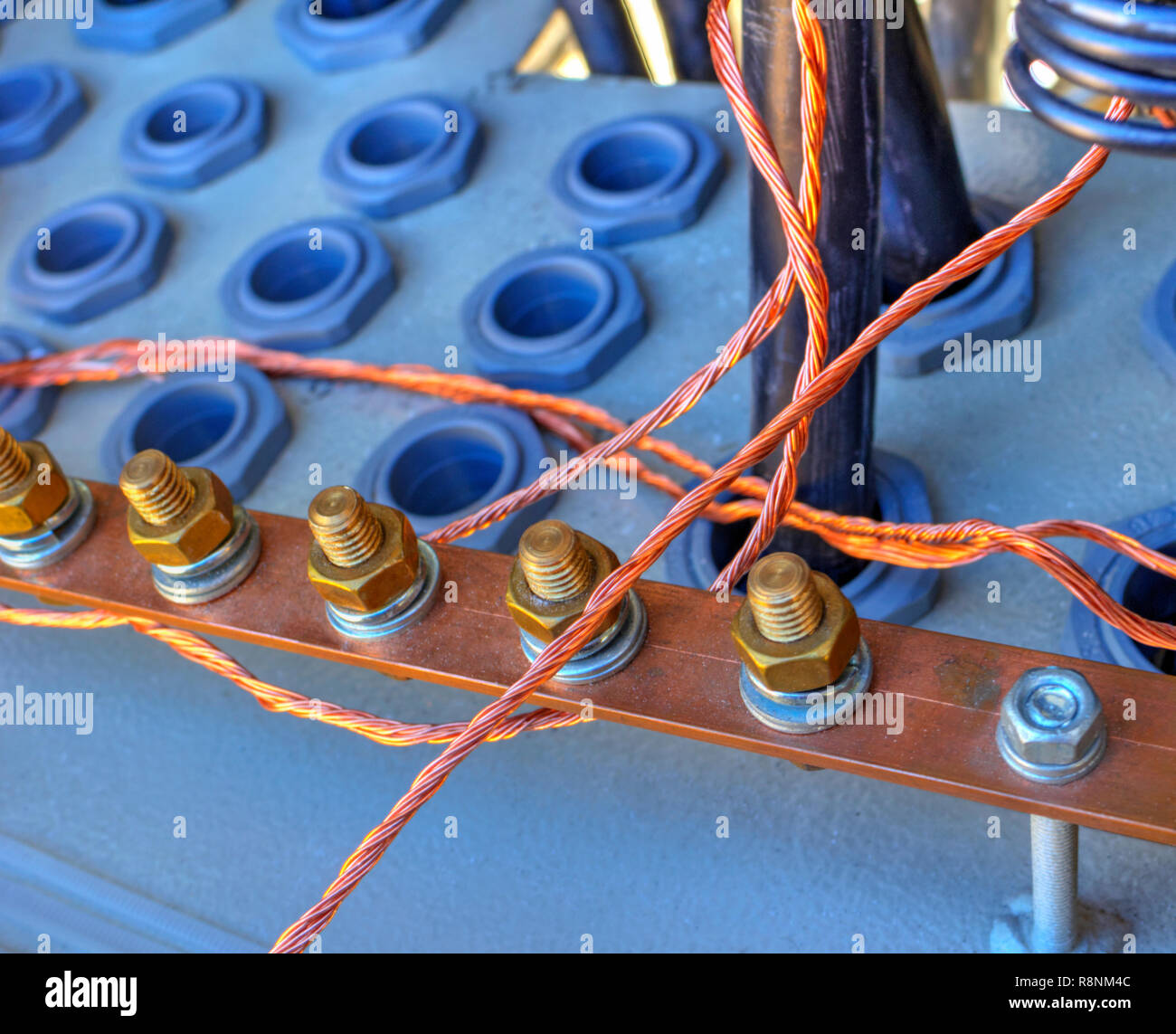 Grounding bus with terminals and wires inside of electrical control