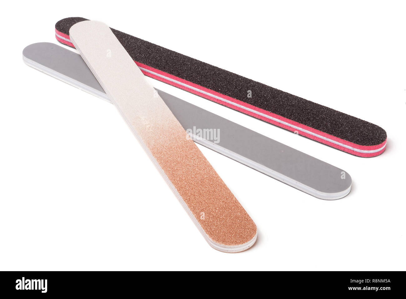 Three nail file with a different abrasive isolated on white background