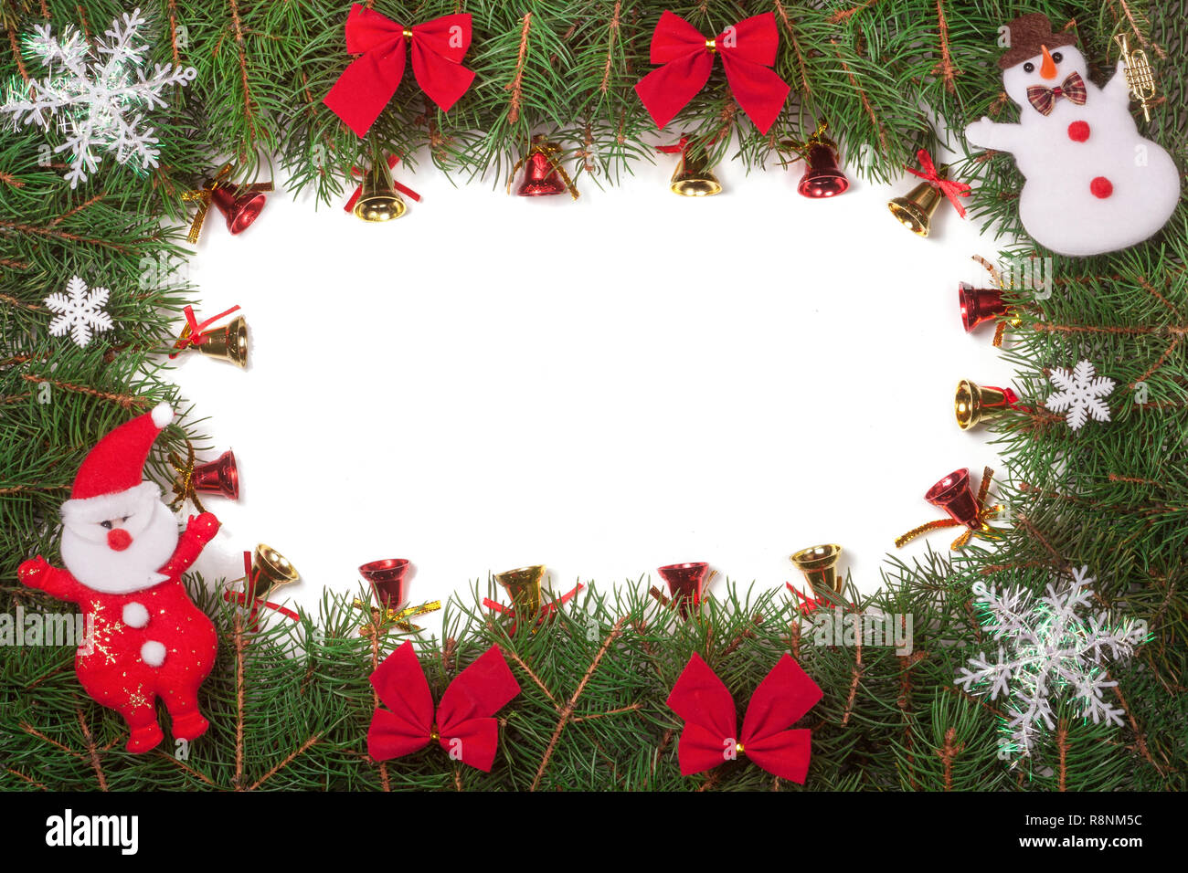 Christmas frame made of fir branches decorated with Santa Claus bows ...