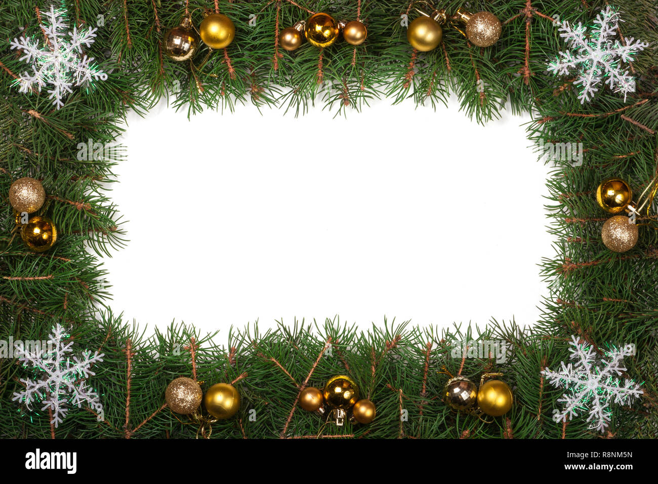 Christmas frame made of fir branches decorated with balls and ...
